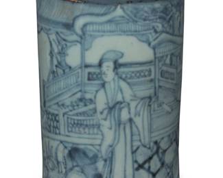 1007 An Asian blue and white porcelain brush pot Possibly Chinese, Qing dynasty With continuous illustration depicting a figure in a courtyard 4.875" H x 3.375" Dia. Estimate: $800 - $1,200