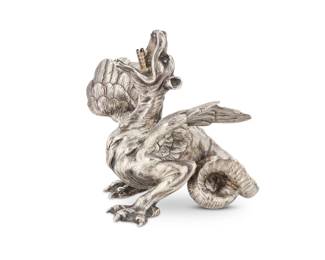 1242 A Fabergé ruby set silver dragon table lighter Circa 1900 Marked for 84 zolotnik and with Cyrillic factory mark With ruby inset eyes, housed in London retailer's original wood and silk-lined presentation box 3.25" H x 3.125" W x 3.125" D; Box: 3.875" H x 4.5" W x 4.5" D 10 gross oz. troy approximately Estimate: $4,000 - $6,000