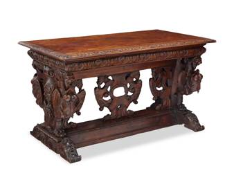 1187 A Renaissance style carved walnut library table 19th century Depicting grotesque beasts and masks 31.5" H x 56" W x 29.5" D Estimate: $1,000 - $2,000