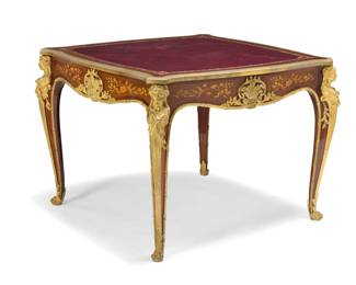 1076 A Louis XV style gift bronze mounted games table François Linke (1855-1946), circa 1890 Etched to drawer bronze mount: F. Linke With gilt-tooled burgundy leather inset top above opposed drawers, floral marquetry, and foliate bronze mounts, the legs with female term chutes ending in paw feet 30.5" H x 40.5" W x 40.5" D Estimate: $7,000 - $9,000