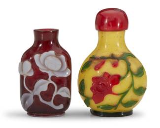 1137 Two Chinese glass overlay snuff bottles 19th/20th century Comprising one mallow flower and another red flower on yellow ground 2 pieces Yellow ground: 3.125" H x 2" W x 1.625" D; Mallow: 2.5" H x 1.5" W x 1" D Estimate: $800 - $1,200