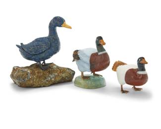 1252 Three carved hardstone models of ducks Late 20th century Comprising one lapis lazuli duck mounted on a pyrite base, and two mixed hardstone ducks, one raised on a quartz base, each with metal feet 3 pieces Largest overall: 3.75" H x 3.5" W x 3" D; Smallest: 2" H x 2.625" W x 1.5" D Estimate: $800 - $1,200