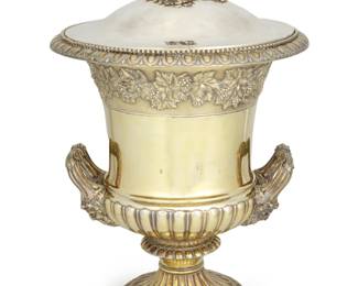 1181 A Paul Storr Ascot Cup silver racing trophy 1821 Lid and base with English hallmarks for London, date, and maker's mark for Paul Storr The vermeil sterling silver trophy with a krater-form urn body, opposed acanthus handles with figural mask terminals, rolled edge with grape and leaf design, gadrooned details, and fluted foot; base engraved "Ascot Races 1822." and personalized "The Most Notable Marquels [sic] Cornwallis, Steward." 15.25" H x 9.75" Dia. 111.57 oz. troy approximately Estimate: $20,000 - $30,000