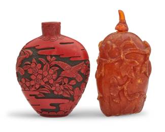 1142 A Chinese amber snuff bottle and a Japanese lacquer snuff bottle Two works:  A Chinese carved amber snuff bottle, 18th/19th century Carved with vines, with a gourd stem cap 2.5" H x 1.625" W x 1.125" D  A Japanese tsuishu lacquer snuff bottle, Meiji Era (1868-1912) or later With red flowers and birds carved to black 2.75" H x 2.125" W x 1" D  2 pieces Estimate: $1,000 - $1,500