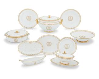 1182 An assembled Louis-Philippe Sèvres porcelain 'Service des Princes' dinner service Second quarter 19th century Each bearing Louis-Philippe monogram mark, one bearing Napoleonic monogram, various chateau marks, some with incised numerals Each with ivy motif to rim, one with variant bellflowers, comprising: 12 dinner plates (8.75") 17 rim soup bowls (9.5") 2 vegetable tureens (3.375" H x 9.75" W x 8.25" D) 1 soup tureen (6.75" H x 12.125" W x 9.625" D) 2 low compotes (8.875") 1 covered sauce tureen (5.5" H x 11.25" W x 6.875" D) 2 oval serving platters (11.875" W x 9.375" D) 1 medium oval server (11.25" W x 6.75" D) 38 pieces Estimate: $2,000 - $3,000