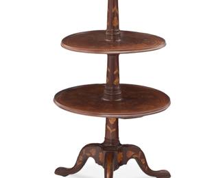 1374 A Dutch marquetry three tier dumbwaiter Late 19th century With overall foliate and floral inlay, raised on turned standard over three flared legs 43" H x 26.5" Dia. Estimate: $400 - $600