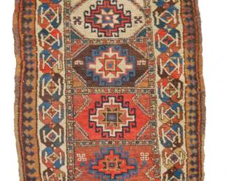 1321 A Kuba runner Early 20th century Wool on wool foundation 9' 6" L x 3' 4" W Estimate: $1,000 - $1,500
