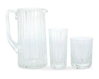 1344 A Baccarat glass 'Harmonie' partial barware set Late 20th century Each with etched factory mark Each glass housed in original box with foam inserts Comprising: 1 pitcher (8.375") 3 double old fashioned glasses (4.125") 6 highball glasses (5.5") 10 pieces Highball box: 4.25" H x 14.75" W x 13.5" D Estimate: $300 - $500