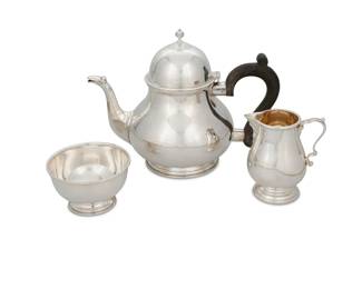 1238 An assembled English sterling silver tea service Three works:  A teapot with wood handle, 1973 With English hallmarks for sterling, Birmingham, date, and maker: B E S & Co. [Barker Ellis Silver Co]; impressed: MADE IN ENGLAND / C2; incised: 03 16 2207 8.25" H x 10.375" W x 5.75" D  An open sugar, 1978 With English hallmarks for sterling, London, 1978, and maker: G & Co. Ld [Garrard & Co Ltd]; impressed: GARRARDS & CO LTD; incised: 03 76c 10258 2.5" H x 4" Dia.  An open creamer With English hallmarks for sterling, Sheffield, 1972, and maker: C B & S [Cooper Brothers & Sons Ltd]; impressed: S2668 / MADE IN ENGLAND / GARRARD & CO LTD; incised: H5245 / 0319B5124 4.5" H x 4" W x 2.875" D  3 pieces Total weight: 40.5 gross oz. troy approximately Estimate: $1,500 - $2,500
