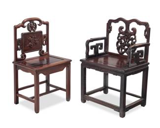 1155 Two Chinese carved hardwood chairs 20th century One with openwork seatback carved with a bat and peaches, the other carved with peaches and scroll elements 2 pieces Bats: 38.75" H x 25.5" W x 20" D; Peaches only: 39" H x 21.25" W x 17" D Estimate: $700 - $900
