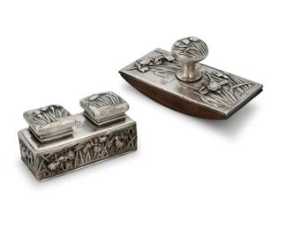 1128 A Japanese sterling silver repoussé inkwell and blotter Late Meiji Era (1868-1912) Inkwell impressed with jungin mark and: KUHN & KOMOR / STERLING Each depicting floral designs, comprising an inkwell with two glass liners and a blotter, each monogrammed 2 pieces Inkwell: 2.375" H x 4.375" W x 2.125" D; Blotter: 2.75" H x 5.25" W x 2.625" D Estimate: $600 - $800