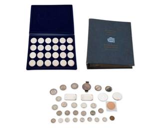 1322 A Group of Coins Including a bound volume of 36 silver minted coins, another volume of Austrian 24 silver minted coins, plus loose bag 32 silver and copper coins and bullion Estimate: $500 - $700