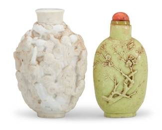 1149 Two Chinese carved porcelain snuff bottles Qing Dynasty (1644-1912) or later The white inscribed to underside: CHINA Comprising a 'One Hundred Boys' white porcelain bottle and a pale green bottle carved with a tree 2 pieces White: 3" H x 2.125" W x 1.75" D; Green: 2.875" H x 1.5" W x 1" D Estimate: $1,000 - $1,500