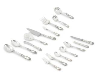1232 A Towle sterling silver 'King Richard' flatware service Mid-20th century Designed 1932 Each with factory marks for Towle and sterling, each monogrammed Comprising 15 dinner forks (7.375") 15 salad forks (6.5") 12 cocktail forks (5.875") 12 cream soup spoons (6.25") 8 oval soup spoons (7.375") 5 tablespoons (8.625") 23 teaspoons (6.125") 14 butter spreaders (5.75") 16 dinner knives (8.75") 7 various serving or other utensils Together with an associated Reed & Barton silver-plated 'Elite' gravy ladle 128 pieces 161.8 oz. troy approximately Estimate: $4,000 - $6,000