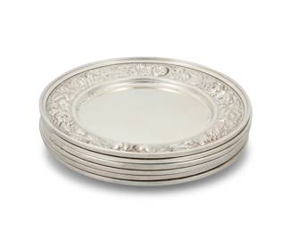 1228 A set of six Stieff sterling silver 'Rose' bread plates Early/mid-20th century Each marked: STIEFF / STERLING / 525 Each with repoussé rose motif border 6 pieces Each: 6.25" Dia. Total weight: 22.9 oz. troy approximately Estimate: $1,000 - $1,500