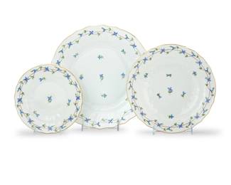 1282 A Herend porcelain 'Blue Garland' part dinner service Late 20th century Designed 1890 by Jeno Farkashazy (1861-1926) Each with blue printed factory mark above painted shape number and pattern: PBG; each with impressed shape number Comprising: 12 dinner plates (11.125") 12 bread & butter plates (7") 8 luncheon plates (9") 32 pieces Estimate: $700 - $900