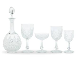 1319 A Baccarat glass 'Colbert' partial stemware service Late 20th century Each with etched factory mark Comprising: 12 tall water goblets (7.25") 12 champagne coupes (4.75") 11 claret wine glasses (5.875") 8 short water goblets wine (6.75") 1 wine decanter (12") 44 pieces Estimate: $1,500 - $2,000