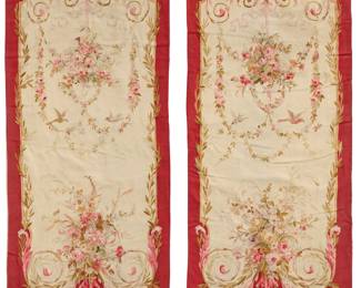 1303 A pair of Aubusson entre-fenêtres tapestries Early 20th century Each woven with birds and floral bunches issuing foliate garlands, one with a lute, and one with pipes and a horn 2 pieces Largest: 9' 4" H x 4' 5" W; Smallest: 9' 2" H x 4' 5" W approximately Estimate: $1,000 - $1,500