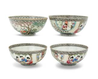 1031 A group of four Chinese Famille Rose eggshell porcelain bowls First half 20th century Each bearing a red and gilt reign mark for Qianlong Period (1736-1795); each inscribed to exterior with unknown red signature Comprising three depicting courtly figures to exterior, and one decorated with goats within a countryside landscape, each within ruyi borders 4 pieces Each: 2.375" H x 5.125" Dia. Estimate: $900 - $1,200