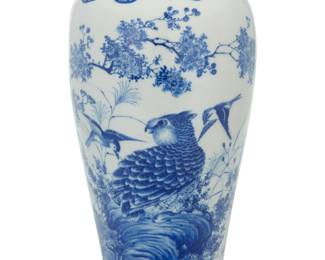 1101 A Japanese Seto ware vase Kawamoto Masukichi (1831-1907) The underside signed in blue underglaze, with an inscribed poem to shoulder Blue on white decorations, depicting waterfowl and other birds in an arboreal tableau 14" H x 7.25" Dia. Estimate: $500 - $700