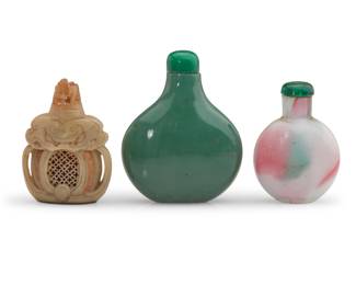 1140 Three Chinese snuff bottles 19th/20th century Comprising a metal-mounted carved soapstone bottle with pierced designs, cloud motifs, and gilt accents, a green glass bottle, and a mottled white, green, and pink glass bottle 3 pieces Largest: 2.5" H x 2" W x 0.875" D; Soapstone: 2.125" H x 1.5" W x 0.75" D Estimate: $700 - $1,000