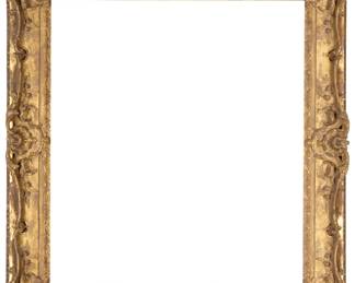 1210 A carved giltwood frame With ornated foliate and floral motifs in high relief, with acrylic sheet Inner: 39" H x 34.5" W; Outer: 52" H x 47" W x 4" D Estimate: $700 - $900