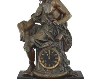 1073 A French patinated bronze clock garniture The figure after Auguste-Joseph Carrier (1800-1875), late 19th/early 20th century Movement impressed: MEDAILLE DE BRONZES / S. Marti et Cie / CHARPENTIER FT DE BRONZES / 309 / A PARIS; dial marked: FELIX CHARPENTIER / BRONZIER / [indisctinct] The clock depicting Hephaestus seated on a column centered by an enamel dial with Roman chapters and twin train movement, raised, raised on a black hardstone base mounted with masks, flanked by a pair of six-light candelabra hung with chains and raised on an urn cast in low relief with maidens, all raised on claw feet over a black hardstone base 3 pieces Clock: 25.75" H x 16" W x 13.5" D; Each candelabra: 33" H x 11.5" Dia. Estimate: $2,000 - $3,000