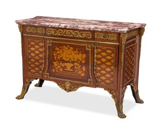 1089 A Louis XVI style marquetry commode After Jean Henri Riesener (1734-1806), late 19th/early 20th century With marble top above a shallow drawer and two locking drawers with floral marquetry, mounted throughout with gilt-bronze foliate motifs, central mask to apron, and paw feet 35.25" H x 56.75" W x 24" D Estimate: $3,000 - $5,000