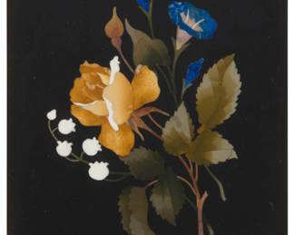 1256 An Italian pietra dura floral plaque 20th century Depicting a rose and lily of the valley, mounted within a shadowbox frame Plaque: 6" H x 4.125" W Estimate: $700 - $900