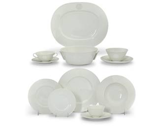 1281 A KPM porcelain 'Arcadia' dinner service Late 20th century Designed 1938 by Trude Petri (1906-1986) Each with KPM underglaze scepter Comprising: 12 dinner plates (10.375") 12 salad plates (8.125") 12 bread & butter plates (6.125") 6 soup bowls (8.75") 12 soup cups with opposed handles (2.125" H x 5.75" W x 4.5" D) 12 underplates (7") 12 flat cups (3.875") 12 saucers (6.625") 1 sauce bowl with attached underplate (3" H x 7.625" Dia.) 2 vegetable serving bowls with handles (8.625") 1 oval serving platter (15.125" W x 12.25" D) 94 pieces Estimate: $600 - $800
