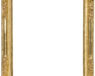 1212 A carved giltwood frame With foliate motifs in high relief Inner: 29" H x 24.5" W; Outer: 37" H x 30.5" W x 4" D Estimate: $400 - $600