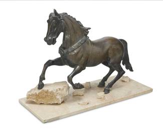 1193 A patinated bronze model of a prancing horse 20th century Unmarked Mounted on a travertine base Bronze: 21.125" H x 27" W x 7.75" D; Overall: 21.75" H x 30" W x 12.25" D Estimate: $500 - $700