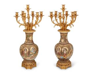 1180 A pair of gilt bronze mounted Japanese Satsuma ceramic candelabra Early 20th century One impressed: F. BARDBEDIENNE; each bearing red underglaze Satsuma marks to underside Each urn with gilt, moriage, and enameled figural decorations, mounted with seven lights and raised on an architectural base with foliate and acanthus accents 2 pieces Each: 34.5" H x 16.5" Dia.; Vase: 18.25" H Estimate: $4,000 - $6,000