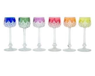 1318 A set of sixteen Baccarat glass 'Colbert' rhine wine glasses Late 20th century Each with etched factory mark Each with tinted cut to clear designs, comprising two or three of each color represented 16 pieces Each: 7.75" H Estimate: $1,000 - $1,500
