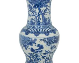 1002 A Chinese blue and white porcelain baluster vase Kangxi Period (1662-1722) or later Unmarked The neck and body depicting arboreal landscapes within friezes bordered by Ruyi 21" H x 11.25" Dia. Estimate: $4,000 - $6,000