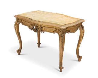 1082 A Louis XV style marble top occasional table 20th century With carved and pierced wood foliate motifs to apron, raised on cabriole legs with scroll feet 24.75" H x 34.25" W x 23" D Estimate: $700 - $900