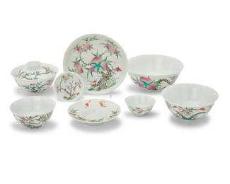 1014 An extensive Chinese enameled porcelain assembled service Predominantly first half of the 20th century Some bearing reign mark for Hongxian Era (1916); some bearing jingde gongsi chupin marks; some stamped: CHINA Each depicting peaches and vines, comprising: 2 rice bowls (4.25" Dia.) 3 covers (3.75") 3 underplates (4.375") 3 sauce bowls (2.75") 6 smaller sauce bowls (2.625") 4 dishes (5.875") 6 bowls (5.5") 6 medium bowls (4.625" Dia.) 8 small bowls (4.375") 11 smaller bowls (3.75") 52 pieces Estimate: $7,000 - $9,000