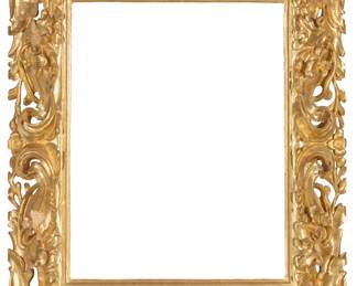 1265 A carved giltwood frame With openwork foliate and scroll motifs in high relief Inner: 26.5" H x 21.75" W; Outer: 38" H x 31" W x 4" D Estimate: $400 - $600