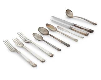 1230 A Tiffany & Co sterling silver 'Hampton' flatware service Mid-20th century Designed 1934 Each marked for Tiffany, sterling, and 'M' [directorship of John C. Moore (1907-1947)] Comprising: 4 dinner knives (10.25") 10 luncheon knives (9.25") 6 steak knives (9.25") 4 dinner forks (7.75") 10 luncheon forks (7.125") 10 salad forks (7") 10 teaspoons (6.125") 10 cream soup spoons (7") 2 oval soup spoons (7.25") 10 butter spreaders (6") 1 gravy ladle (7.5") 77 pieces Total weighable sterling: 100.5 oz. troy approximately Estimate: $3,000 - $4,000