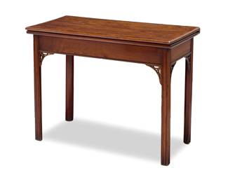 1334 A George III mahogany flip top games table Early 19th century The top with inlaid border, opening to reveal green felt, above single swing leg and three fixed, each with openwork corbel Stored: 28.25" H x 36.25" W x 17.65" D; Open: 35.25" D Estimate: $400 - $600