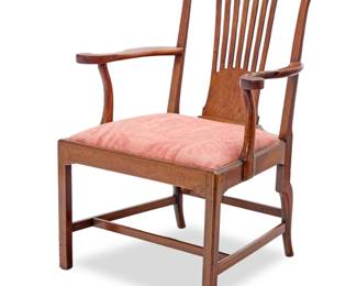 1378 A George II mahogany open armchair 18th century With openwork back splat and carved accents to corners of crest rail, the seat later upholstered in a foliate pattern fabric 41" H x 31" W x 28" D Estimate: $200 - $400