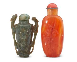 1139 Two Chinese carved hardstone snuff bottles Qing Dynasty (1644-1912) or later Comprising one spinach jade bottle carved with opposed chilong figures, and a carved hardstone bottle with foliate motifs 2 pieces Jade: 2.75" H x 1.75" W x 1" D; Orange: 3.375" H x 1.375" W x 1" D Estimate: $1,000 - $1,500