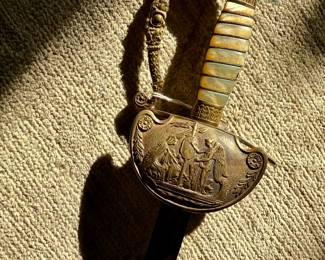 Militia Eagle Head Officer’s Sword with ornate etched guard, carved mother-of-pearl style grip, and detailed eagle head pommel. A striking decorative military piece with excellent display presence for collectors of militaria, swords, and antique weapons. Circa 1820’s
