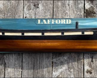 Capt. Scott "LAFFORD" 1876 - Nautical Folk Art Ship Plaque Striking hand-crafted nautical wall sculpture featuring the hull profile of the vessel "LAFFORD" dated 1876, titled "Capt. Scott." Mounted on a painted wooden backboard with a rich maritime blue ground. The three-dimensional carved hull, painted in classic black, cream, and warm varnished tones, projects beautifully from the surface, giving it depth and presence. A wonderful coastal statement piece with strong New England maritime character. Whether inspired by a historic schooner or created as commemorative nautical folk art, this piece captures the romance of 19th-century seafaring. nautical wall art, ship plaque, maritime decor, folk art ship, carved wooden boat, coastal wall sculpture, schooner wall art, captain decor, vintage nautical, lake house decor, seaside art, maritime collectible, 1876 ship, seafaring decor, estate sale find