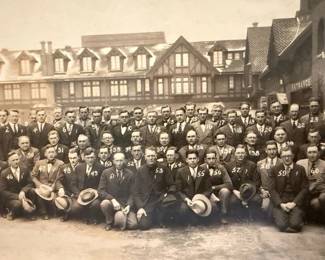 Numbers on jacket identify man & dairy farm they own on back of photo.