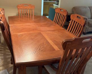 Mission Style dining table, leaves and eight chairs. Excellent condition