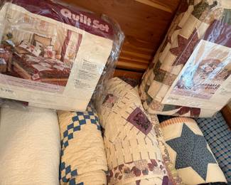 Quilt sets by JC Penney and vintage handstitched quilts 