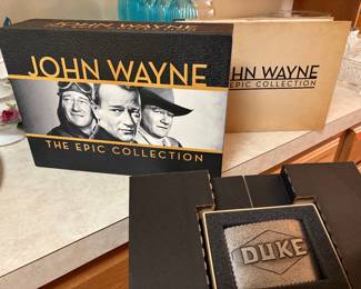 Rare John Wayne "The Epic Collection" The John Wayne Epic Collection is a massive 38-disc DVD box set released by Warner Home Video. It contains 40 iconic John Wayne films—spanning classic westerns, war films, and historical dramas—along with a bonus disc of special features, a book, and an exclusive "Duke" belt buckle