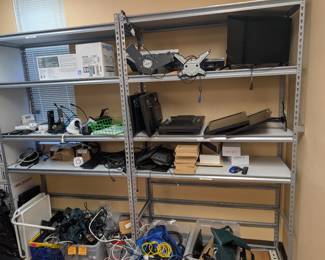 Two metal shelving units content sold separately