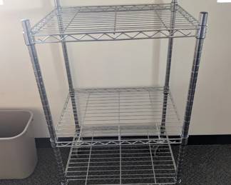 Rolling metal shelving unit